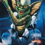 La locandina del film Gremlins, di Joe Dante, con l'iconico mostriciattolo in evidenza