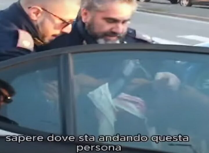 Nella foto tratta dal video, il momento del fermo di un attivista a Brescia