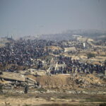 Internally displaced Palestinians make their way from southern to northern Gaza along Al Rashid road, central Gaza Strip, 27 January 2025