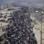 Internally displaced Palestinians make their way from southern to northern Gaza along Al Rashid road, central Gaza Strip, 27 January 2025