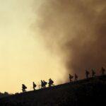 Firefighters take up positions to fight the Kenneth wildfire in the Woodland Hills neighborhood of Los Angeles, California, USA, 09 January 2025. According to the California Governor's office, more than 7,500 firefighting and emergency personnel are involved in response efforts, as multiple wildfires are burning across thousands of acres and have forced widespread evacuations in the Los Angeles area.